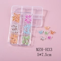 Dettaglio della scatola a 6 griglie con ciondoli a farfalla in resina per nail art - Farfalla Luccicante (H33) / Scatola a 6 Griglie