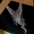 Silver fringe rhinestone necklace set displayed on a premium black velvet jewelry box - Luxury V-Shaped Tassel Necklace - Silver