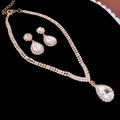 Golden jewelry set with water-drop crystals featuring necklace and earrings on black background - Multi-Row Fine Diamonds with Large Drop / Gold