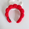 Red plush padded headband with cloud bubble design on white stand for hair styling - Red