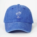 Blue washed denim baseball cap with white embroidered palm trees logo on a white background - Sapphire Blue