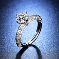 Macro side view of a six-prong silver moissanite ring with detailed side accent stones - Y110 Six-Prong Pave with Pink Accent