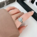 Minimalist adjustable silver ring featuring an oval irregular relief design on hand - Irregular Round Ring J0303B-Coin Style