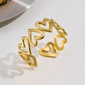 Golden stainless steel open bangle with minimalist hollow heart shapes and sleek finish - Gold Heart Hollow