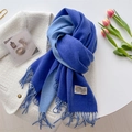 Flat lay of royal blue and light blue double-sided cashmere scarf with tassels - Sapphire Blue