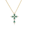 Macro view of gold cross necklace featuring pear-cut green and white cubic zirconia - Gold Green Zirconia