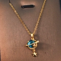 Golden planet necklace with blue celestial sphere and sparkling star pendant detail - Gold - Planet Pentagram
