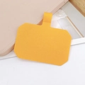 Detail of yellow woven strap connector patch with metal ring for phone cases - Turmeric