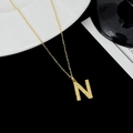 Chic S925 silver necklace featuring a gold letter N pendant with sparkling white zircons - Letter N