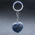 Close-up of heart-shaped blue sodalite stone keychain with silver metal ring and chain - Blue Spot Stone