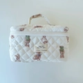 Detail of quilted cotton makeup bag featuring cute teddy bear patterns and top handle - Rabbit and Bear