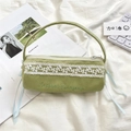 Close-up of light green corduroy pencil case with lace detail and blue ribbon bows - Light Green