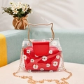 Transparent PVC tote with white daisy print and a red inner pouch with gold cat ear handles - Red