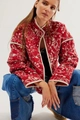 Close-up of red paisley quilted jacket featuring intricate floral patterns and stand collar - Red Floral