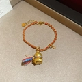 Dettaglio del bracciale placcato oro 24K con ciondolo a zucca, corda rossa e nappa colorata - Stile Intrecciato Sacchetto della Fortuna Zucca Nappina Colorata Oro Rosso (18#)