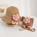 Detail of kids straw sun hat and matching bag set with pink flowers and cherry charms - Hat + Bag Set / Brown