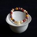 Detailed close-up of multi-colored Buddhist beads with a white guardian lion pendant - Multicolor (8mm*22 Beads Lion Dance Style)
