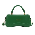 Chic vibrant green leather crossbody bag with curved base and golden fashion logo - Green