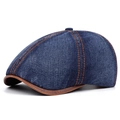 Detalle de gorra vintage de mezclilla con costuras en contraste y visera de cuero sintético - Azul marino