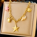 Detail of gold ocean charm necklace with starfish, turtle, and shell pendants on satin stand - Sea Turtle Starfish Shell Style (N3132)