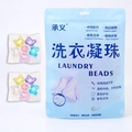 Five-in-one cat-shaped laundry beads in a blue zip bag with multi-colored pods - 6-Chamber Cat Head 30 Capsules Bagged