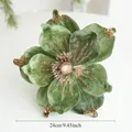 Detailed view of 24cm green velvet magnolia with golden glitter for Christmas decor - Green