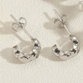 Detail showing wave-textured C-shape earrings in 14K gold-plated copper with zircon accents - C-Shape Wavy-Silver