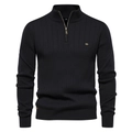 Close-up of black men's half-zip knit sweater showing ribbed texture and collar detail - Black
