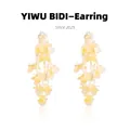 Macro shot of sparkling beige floral tassel earrings with translucent petal clusters - Pale Yellow Lightweight Resin Flower Style (9#)