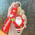 Adorable Santa Claus silicone keychain featuring a red Christmas hand strap gift accessory - Santa With One Gift