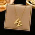 Polished gold initial W pendant necklace displayed on a luxury jewelry box - Gold-W