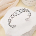 Elegant silver stainless steel open cuff bracelet with interconnected metal links - Chain / Steel
