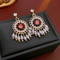 Detailed shot of ethnic style earrings with pink crystals and purple teardrop tassels - Silver Pin - Pink & Black