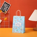 Detailed view of blue Happy Birthday gift bag with cake illustrations and white handles - 604-2 (Blue Cake)