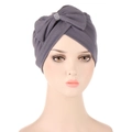 Macro shot of grey turban headwrap with large bow knot and sparkling rhinestone detail - Gray