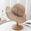 Detail view of khaki knit sun hat with hollow texture on a modern minimalist display stand - Adult/55-57cm (Adjustable) / Khaki