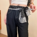 Detail of a black and white paisley silk scarf used as a stylish belt on denim jeans - 38# Black