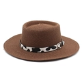 Detail of dark brown woven straw hat featuring a chic cow print band and silver buckle - M (56-58cm) / Brown