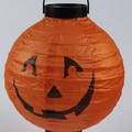 Foldable orange paper pumpkin lantern with a classic black Jack-o-lantern face and handle - Yellow Pumpkin Glowing Lantern