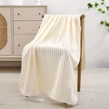 Creamy beige striped coral fleece towel draped over a wooden chair in a cozy home setting - Bath Towel (70x140cm) / Yellow