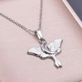 Close-up of silver moth and crescent moon pendant in a jewelry box for DIY necklaces - Silver Color Pendant Necklace