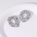 Minimalist silver irregular hammered round stud earrings with textured molten metal finish - Steel
