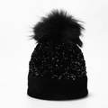 Detailed view of shimmering sequins and large faux fur pom-pom on women's winter knit beanie - One Size / Black (Dyed Pom Pom)