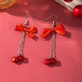 Detailed view of red ribbon bow earrings with silver chains and festive bell pendants - D1304 (Bowknot Bell)
