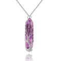 Macro detail of purple amethyst hexagonal pendant with handcrafted silver wire tree of life - Wire Wrapped Amethyst + Metal Chain