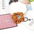 Single golden brown satin silk scrunchie on a white ceramic plate with artistic props - 5#-Golden Brown