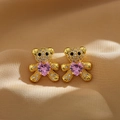 Micro-paved gold bear stud earrings with pink heart gemstone on silk background - Gold Panda/Bear