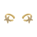 Macro detail of gold star ear cuffs with sparkling clear cubic zirconia crystals - Gold Starfish White Zircon Ear Cuff