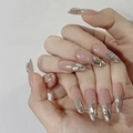 Elegant long stiletto press-on nails with nude glitter gradient and large rhinestones - By1550 Jade Burial Suit / Phototherapy Glue Style