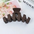 Matte dark chocolate brown wavy hair claw clip in a geometric interlocking design - Chocolate